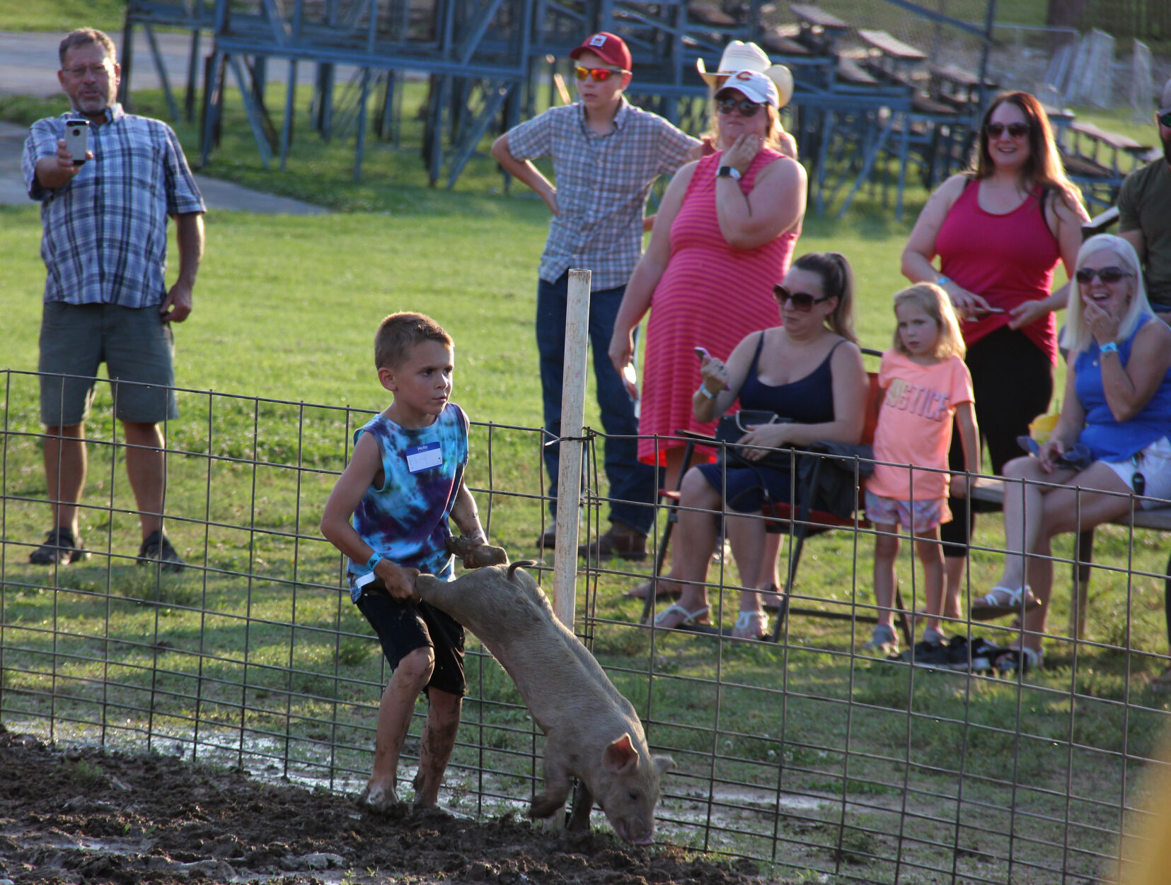 Cooper Bellamy participates in pig scramble